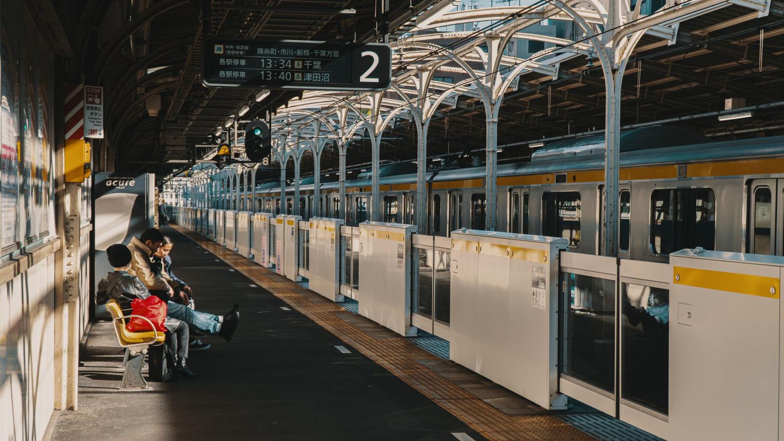 Passengers Waiting at Tokyo Train Station Platform
